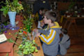 A student studies the flowers